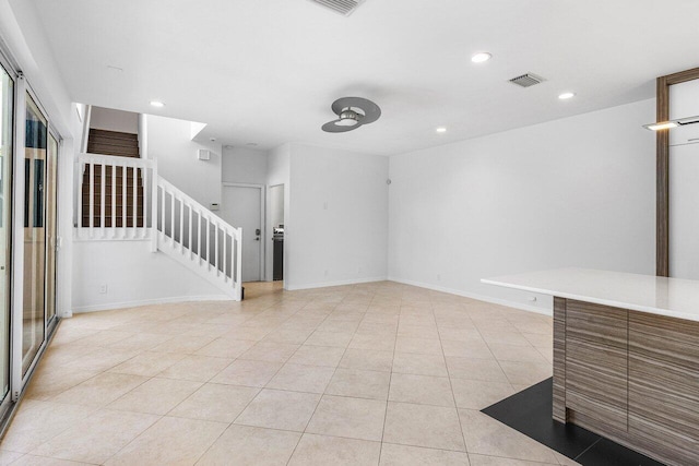 5779 Regency Cir W, Boca Raton, FL 33496 - unfurnished living room with stairs, light tile patterned floors, and recessed lighting