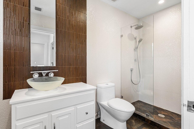 5779 Regency Cir W, Boca Raton, FL 33496 - bathroom featuring walk in shower, vanity, toilet, and tile walls