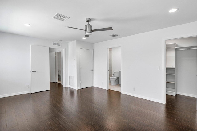 5779 Regency Cir W, Boca Raton, FL 33496 - unfurnished bedroom with recessed lighting, a spacious closet, wood finished floors, baseboards, and ensuite bath
