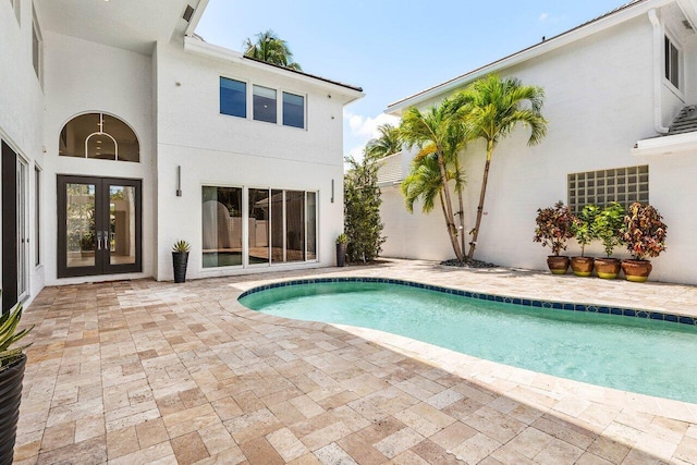 5779 Regency Cir W, Boca Raton, FL 33496 - outdoor pool featuring french doors and a patio area