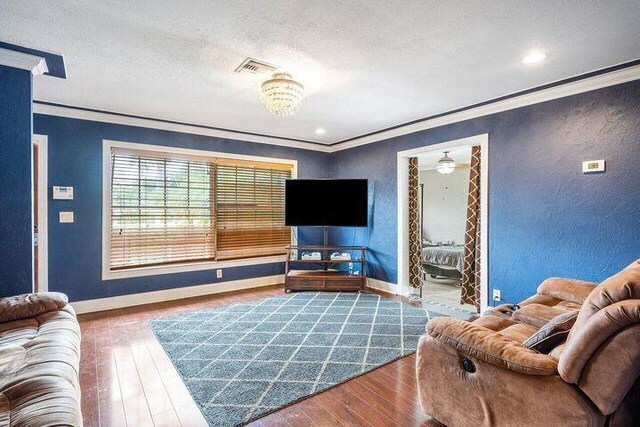803 Mallard Dr, Delray Beach, FL 33444 - living area with ornamental molding, hardwood / wood-style floors, baseboards, recessed lighting, and a textured ceiling