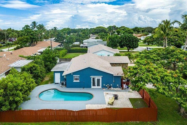 803 Mallard Dr, Delray Beach, FL 33444 - view of swimming pool featuring a fenced backyard, a patio area, and french doors