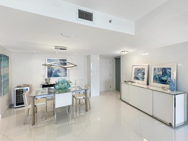 3000 N Ocean Dr Unit 4-D, Singer Island, FL 33404 - dining room with beverage cooler and light tile patterned flooring
