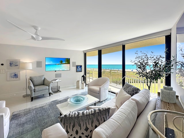 3000 N Ocean Dr Unit 4-D, Singer Island, FL 33404 - living room with baseboards, a ceiling fan, and expansive windows