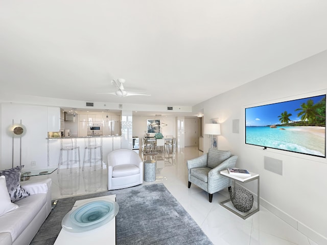 3000 N Ocean Dr Unit 4-D, Singer Island, FL 33404 - living room with light tile patterned flooring, ceiling fan, and baseboards