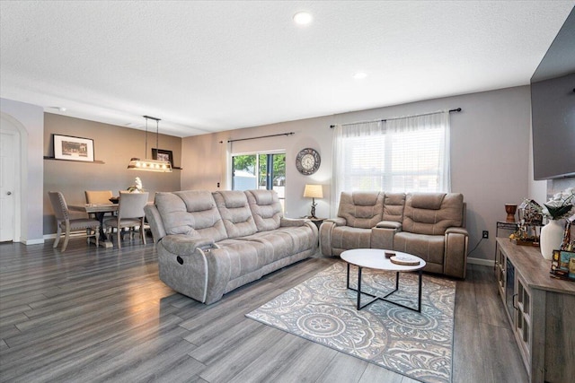 3313 SW Ludlow St, Port Saint Lucie, FL 34953 - living room featuring dark wood-type flooring, baseboards, and recessed lighting