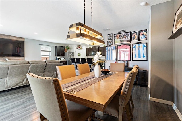 3313 SW Ludlow St, Port Saint Lucie, FL 34953 - dining area featuring wood finished floors