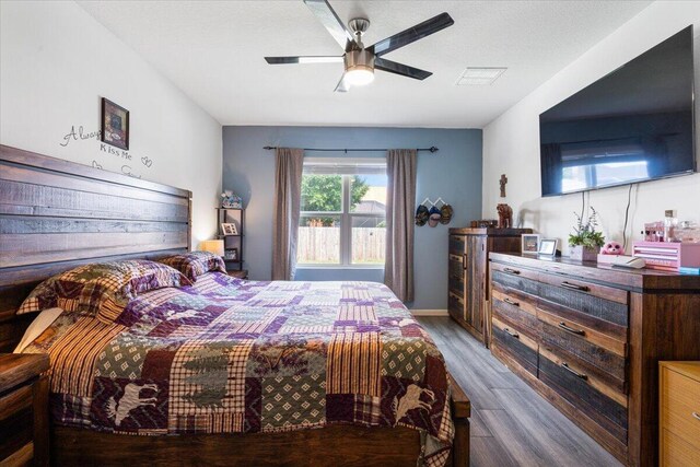 3313 SW Ludlow St, Port Saint Lucie, FL 34953 - bedroom with wood finished floors and a ceiling fan