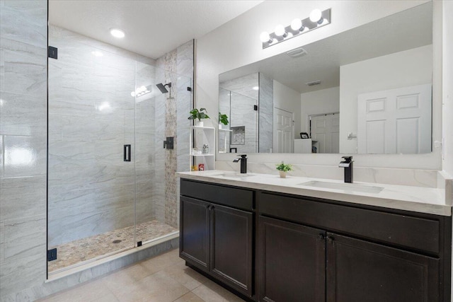 3313 SW Ludlow St, Port Saint Lucie, FL 34953 - bathroom featuring a stall shower, double vanity, and tile patterned floors