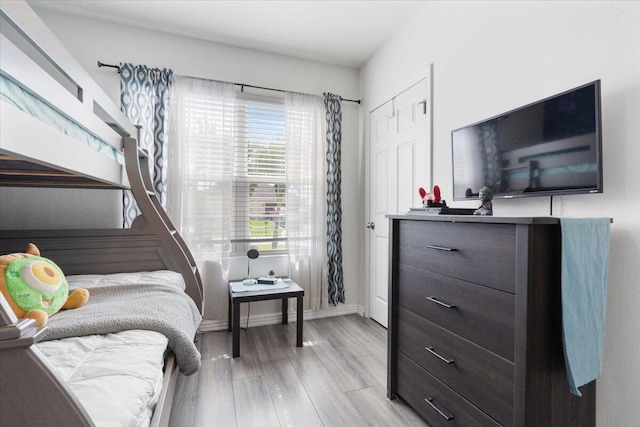 3313 SW Ludlow St, Port Saint Lucie, FL 34953 - bedroom with light wood finished floors and baseboards