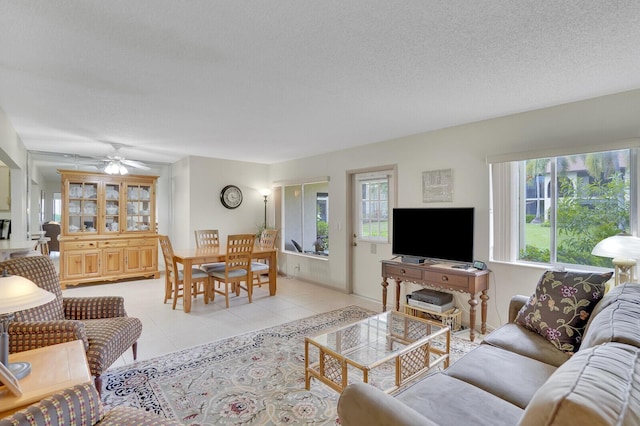 331 Knotty Pine Cir Unit C-1, Greenacres, FL 33463 - living room with plenty of natural light, light tile patterned flooring, a ceiling fan, and a textured ceiling