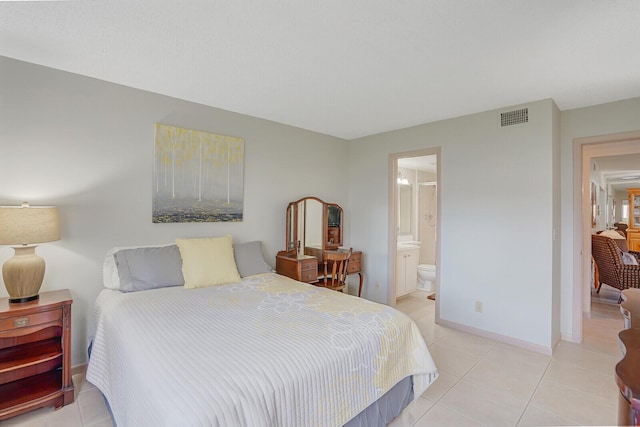 331 Knotty Pine Cir Unit C-1, Greenacres, FL 33463 - bedroom featuring light tile patterned flooring, ensuite bathroom, and baseboards
