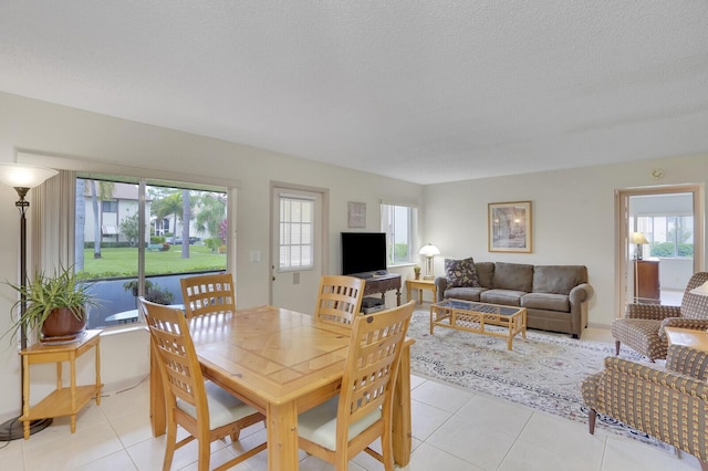 331 Knotty Pine Cir Unit C-1, Greenacres, FL 33463 - dining area featuring light tile patterned floors and a textured ceiling