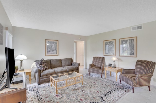 331 Knotty Pine Cir Unit C-1, Greenacres, FL 33463 - living room with light tile patterned flooring and a textured ceiling