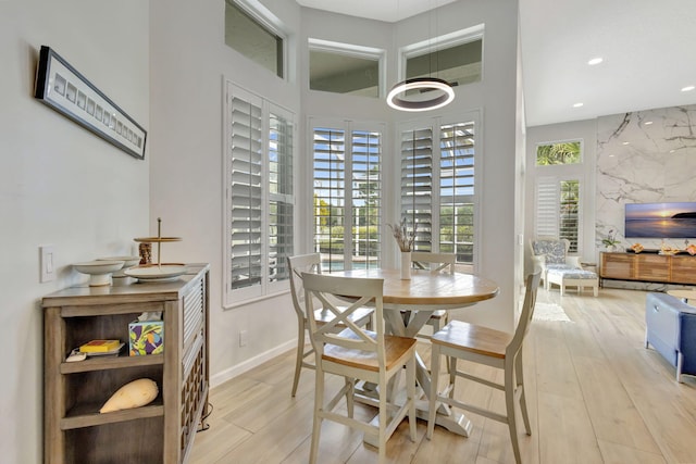 2703 SW Glenmoor Way, Palm City, FL 34990 - dining space featuring light wood-type flooring, recessed lighting, and baseboards