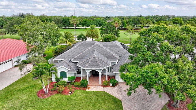 2703 SW Glenmoor Way, Palm City, FL 34990 - view of subject property with a tree filled landscape