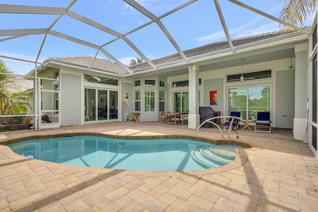2703 SW Glenmoor Way, Palm City, FL 34990 - outdoor pool featuring a patio area and glass enclosure