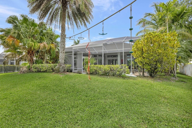 2703 SW Glenmoor Way, Palm City, FL 34990 - rear view of house with a lanai