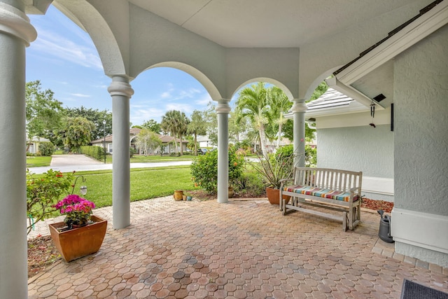 2703 SW Glenmoor Way, Palm City, FL 34990 - porch featuring a yard