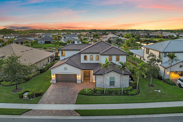 515 Sonoma Isles Cir, Jupiter, FL 33478 - view of front of property with a tile roof, a residential view, driveway, a garage, and stucco siding
