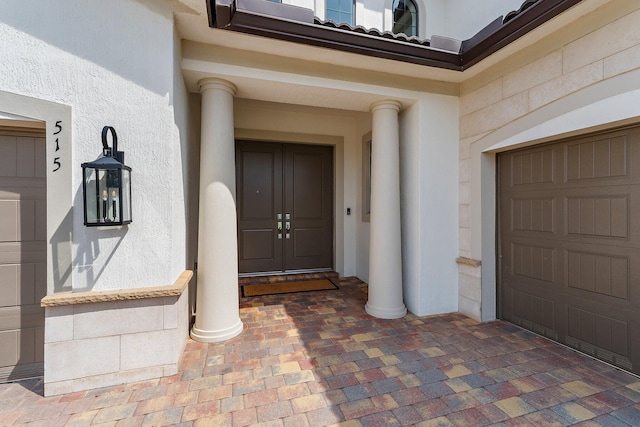515 Sonoma Isles Cir, Jupiter, FL 33478 - property entrance featuring stucco siding and a garage