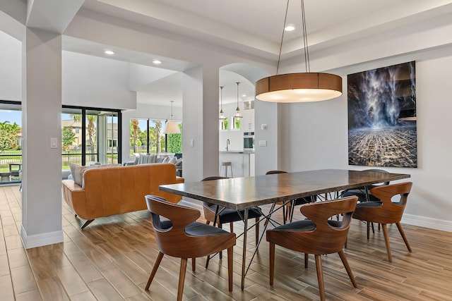 515 Sonoma Isles Cir, Jupiter, FL 33478 - dining space featuring wood finish floors, baseboards, recessed lighting, and a tray ceiling