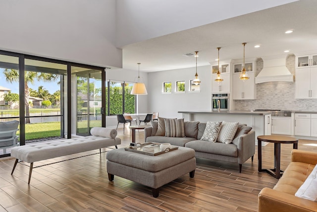 515 Sonoma Isles Cir, Jupiter, FL 33478 - living area with dark wood-style flooring and recessed lighting
