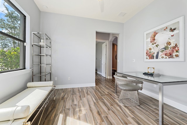 515 Sonoma Isles Cir, Jupiter, FL 33478 - unfurnished office featuring wood finish floors, arched walkways, and baseboards