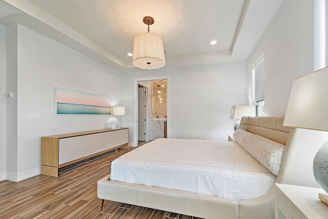 515 Sonoma Isles Cir, Jupiter, FL 33478 - bedroom with a tray ceiling, wood finished floors, recessed lighting, and baseboards