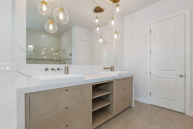 515 Sonoma Isles Cir, Jupiter, FL 33478 - bathroom with double vanity, a shower stall, baseboards, and tile patterned floors
