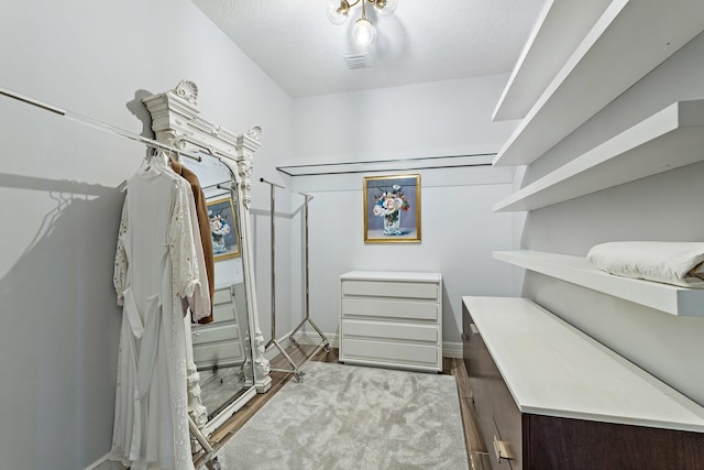 515 Sonoma Isles Cir, Jupiter, FL 33478 - walk in closet featuring wood finished floors