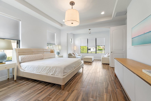 515 Sonoma Isles Cir, Jupiter, FL 33478 - bedroom with a raised ceiling, dark wood-type flooring, recessed lighting, and baseboards
