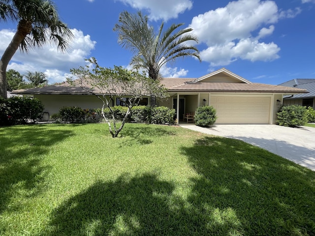 18402 Lake Bend Dr, Jupiter, FL 33458 - single story home featuring an attached garage, concrete driveway, and a front yard