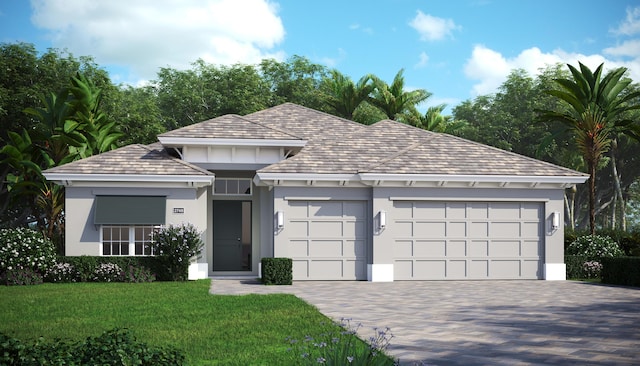 9379 SW Pinnacle Pl N, Port Saint Lucie, FL 34987 - view of front of property with an attached garage, a front lawn, stucco siding, and driveway