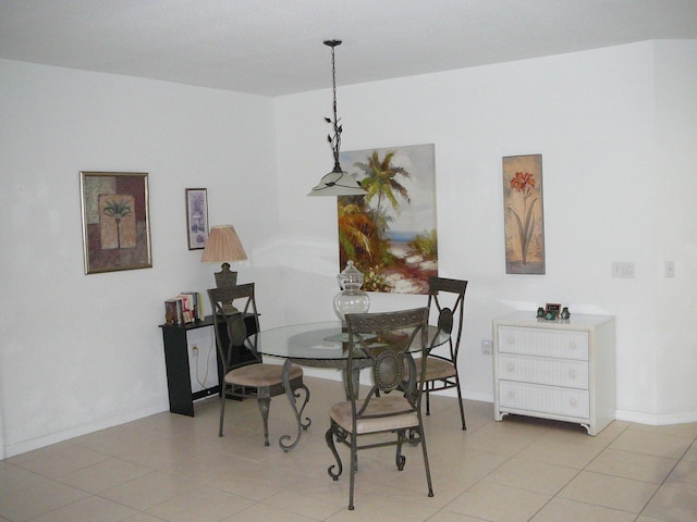 1840 E Sanderling Ln Unit 1, Fort Pierce, FL 34982 - dining area featuring baseboards and light tile patterned floors