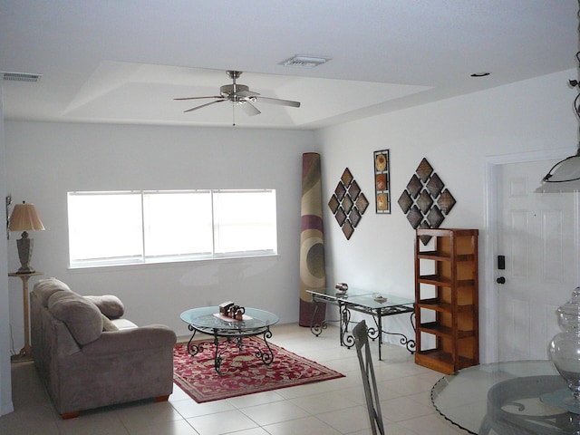 1840 E Sanderling Ln Unit 1, Fort Pierce, FL 34982 - living room featuring ceiling fan, healthy amount of natural light, light tile patterned floors, and a raised ceiling
