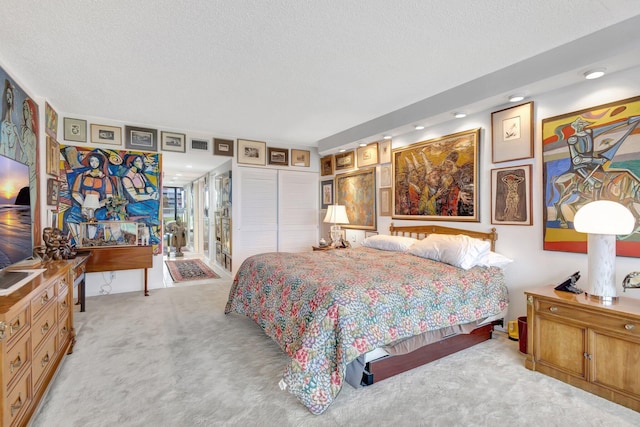 3300 S Ocean Blvd Unit 103S, Palm Beach, FL 33480 - carpeted bedroom featuring a closet, a textured ceiling, and recessed lighting