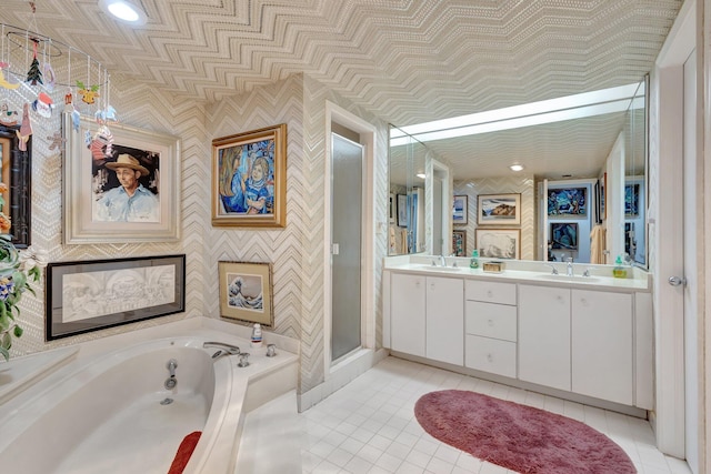 3300 S Ocean Blvd Unit 103S, Palm Beach, FL 33480 - full bathroom featuring wallpapered walls, a garden tub, double vanity, tile patterned floors, and a stall shower