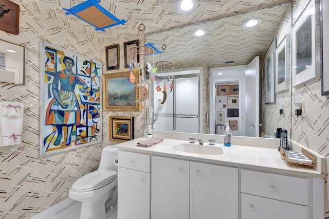3300 S Ocean Blvd Unit 103S, Palm Beach, FL 33480 - bathroom featuring vanity, toilet, and tile patterned flooring