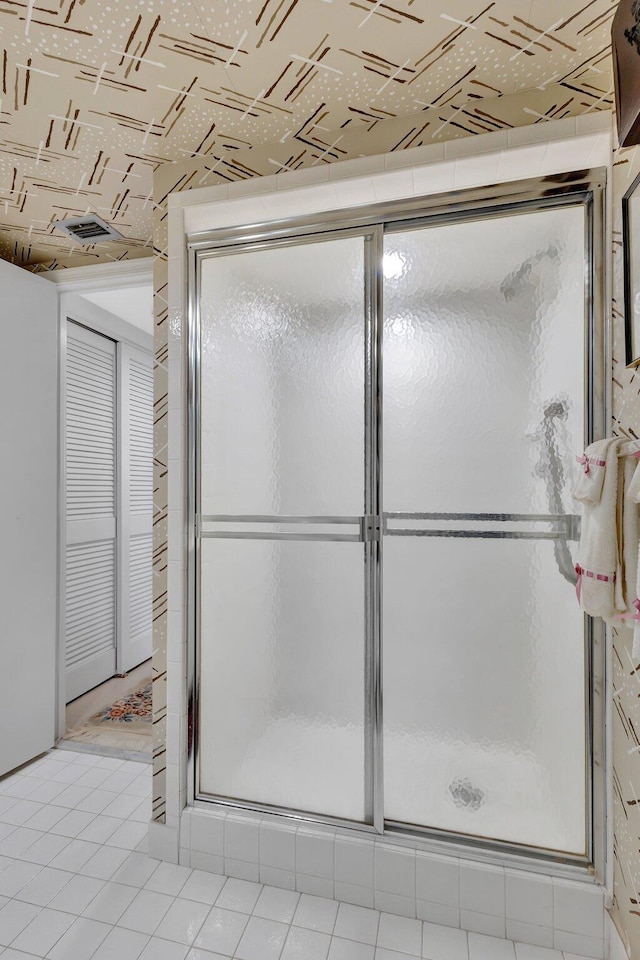 3300 S Ocean Blvd Unit 103S, Palm Beach, FL 33480 - bathroom featuring a shower stall and tile patterned floors