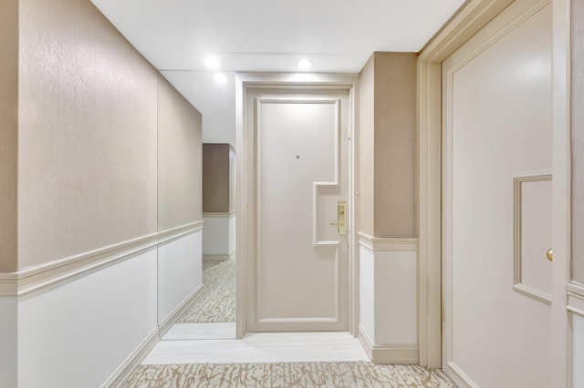3300 S Ocean Blvd Unit 103S, Palm Beach, FL 33480 - hallway featuring light wood-style flooring and baseboards