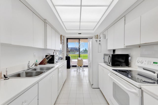 3300 S Ocean Blvd Unit 103S, Palm Beach, FL 33480 - kitchen featuring white appliances, a sink, light tile patterned flooring, and light countertops