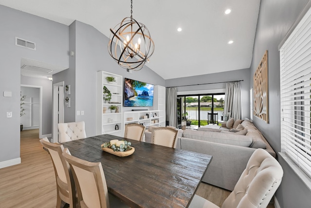 23283 Boca Trace Dr, Boca Raton, FL 33433 - dining room with high vaulted ceiling, light wood-type flooring, baseboards, a chandelier, and recessed lighting