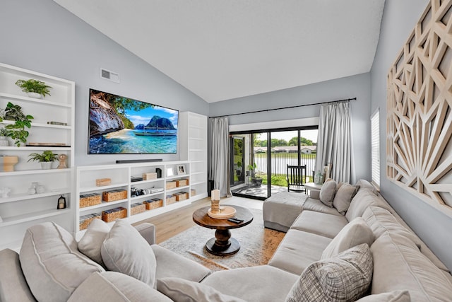 23283 Boca Trace Dr, Boca Raton, FL 33433 - living area featuring wood finished floors, high vaulted ceiling, and built in shelves