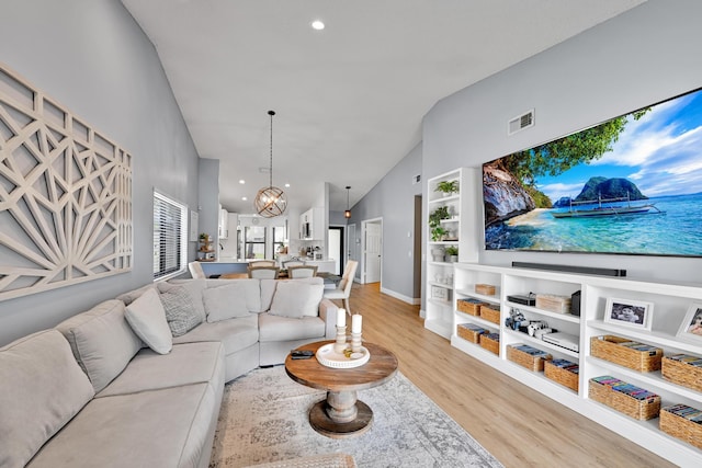 23283 Boca Trace Dr, Boca Raton, FL 33433 - living room featuring light wood-style floors, high vaulted ceiling, a chandelier, recessed lighting, and baseboards