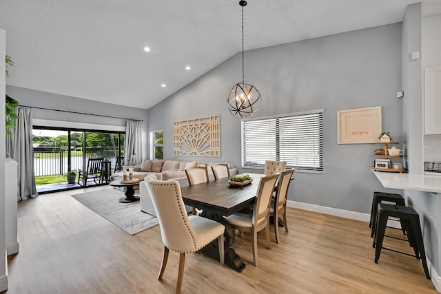 23283 Boca Trace Dr, Boca Raton, FL 33433 - dining space featuring high vaulted ceiling, recessed lighting, a chandelier, light wood finished floors, and baseboards