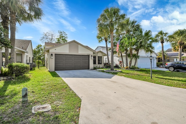 23283 Boca Trace Dr, Boca Raton, FL 33433 - view of front of house with concrete driveway, an attached garage, and stucco siding