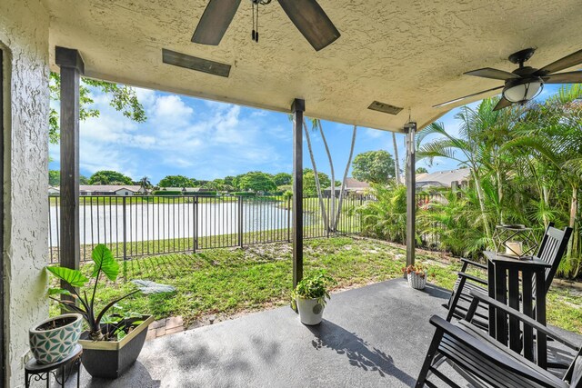 23283 Boca Trace Dr, Boca Raton, FL 33433 - view of patio / terrace with a water view and a ceiling fan