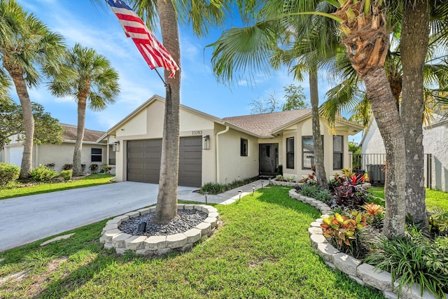 23283 Boca Trace Dr, Boca Raton, FL 33433 - view of front of house with stucco siding, a garage, and concrete driveway