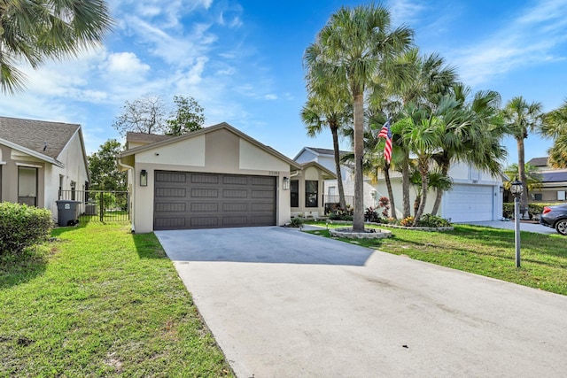23283 Boca Trace Dr, Boca Raton, FL 33433 - view of front of property with stucco siding, an attached garage, and concrete driveway